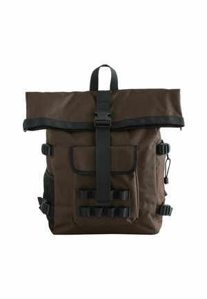 Brown roll-top backpack made of durable fabric, featuring black straps, a front pocket, side mesh, and adjustable buckles.