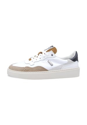 White low-top sneaker with beige suede accents, brown perforated tongue, black heel tab, and white laces on a thick white sole.