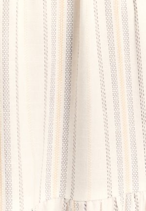 Tessuto bianco con strisce verticali in beige chiaro e blu navy. Presenta una trama strutturata e un orlo arricciato sottile sul fondo.