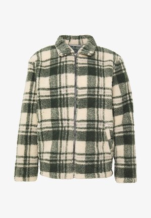 Veste polaire avec fermeture éclair sur le devant, motif à carreaux vert et crème, manches longues et col montant. Tissu doux et texturé.