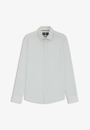 Camicia bianca a maniche lunghe con colletto classico, chiusura a bottoni e texture morbida. Presenta un leggero luccichio e una vestibilità su misura.