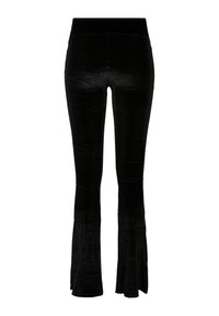 Pantalon taille haute en velours noir avec une coupe ajustée à la cuisse et une jambe évasée, présenté debout sur fond blanc.