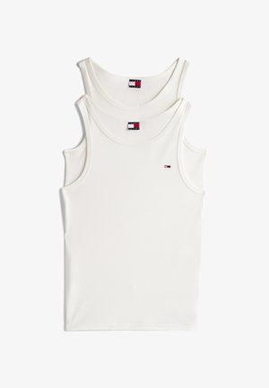 Dva bele majice bez rukava složene, sa logotipom Tommy Jeans na prednji strani i oznakom na izrezu.