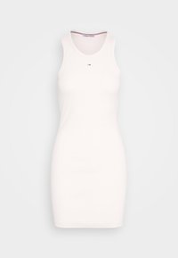 Bílá žebrovaná tanková šatovka s přiléhavým střihem. Má kulatý výstřih a malé logo na hrudi. Měkký, elastický materiál.