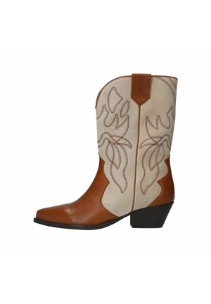 Tan and beige cowboy boots with floral embroidery, pointed toe, and a low black heel. Made of leather with a smooth texture.