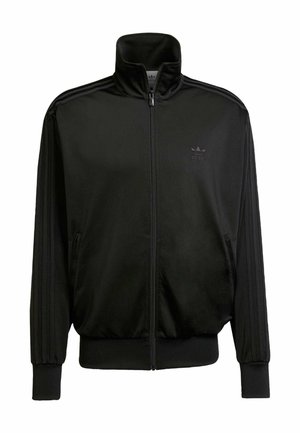 Sort Adidas træningsjakke med fuld lynlås foran, opretstående krave, ribkantede ærmeender og nederst samt diskret Adidas-logo på brystet.