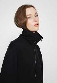 MSCH Copenhagen IMA ZIP DRESS - Vestido de malha - black