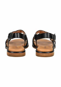 Schwarze Leder-Sandalen mit offenem Design, verstellbarem Schnallenriemen und einer glatten, hellbraunen Innensohle mit einer kontrastierenden Sohle.