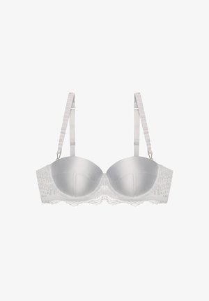 White underwired bra with smooth satin cups, lace trim, and adjustable straps featuring a ribbed design and metal accents.