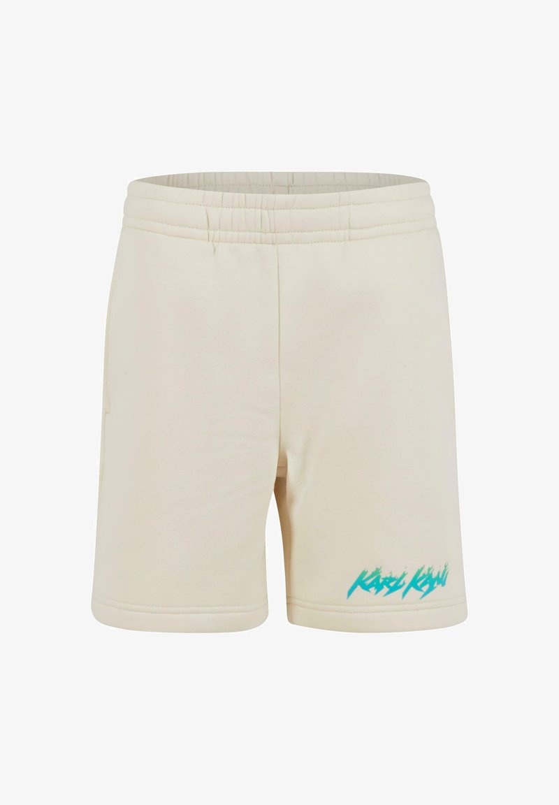 Kremo spalvos šortai, pagaminti iš minkštos medžiagos, su elastinga juosmens juosta ir turkio spalvos grafiniu akcentu priekyje.