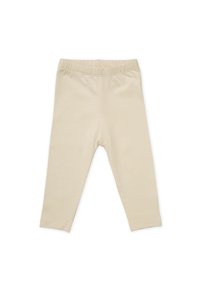 Leggings beiges en tissu doux avec une taille élastique et une coupe slim. Sans motifs ni embellissements.