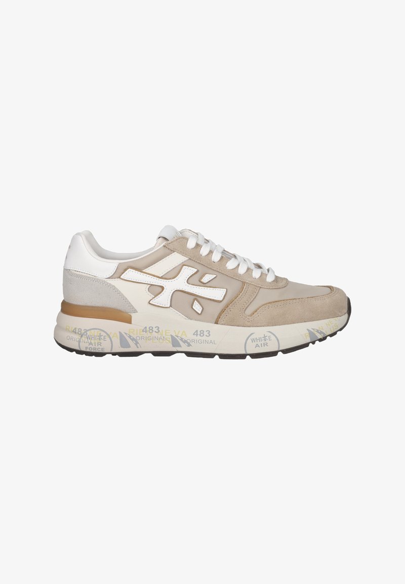 Beige sneaker with white accents, suede and leather materials, round toe design, cushioned sole, and patterned branding on the midsole.