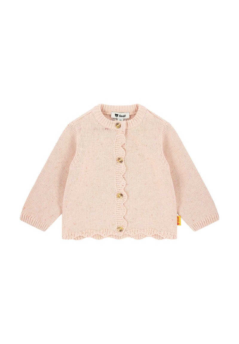 Světle růžový pletený cardigan s dlouhými rukávy, vlnitým lemem a čtyřmi zlatými knoflíky. Na boku se nachází štítek.