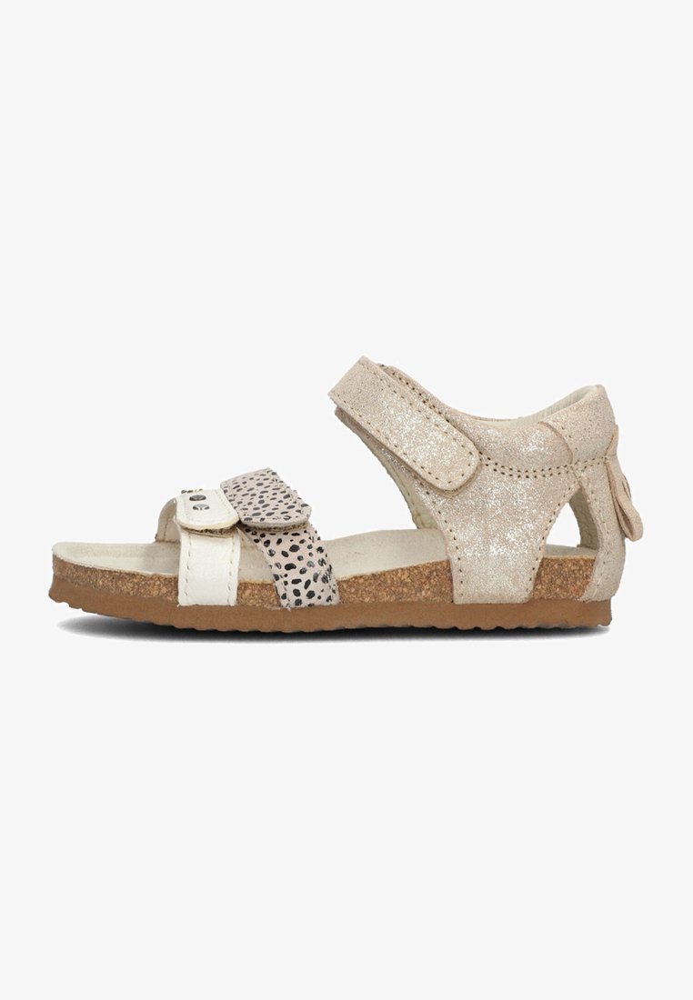 Beige sandalen met glinsterende accenten, een diPrint band, klittenbandsluitingen, kurken voetbed en een gestructureerde zool. Ontworpen voor comfort en ademend vermogen.