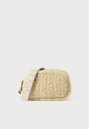 Quilted beige bag with a rectangular shape, featuring a patterned light strap. Made of soft material with diamond-shaped accents.
