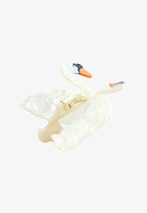 Two white swan-shaped hair clips with orange beaks and black eye markings, featuring a spring-loaded clasp mechanism.