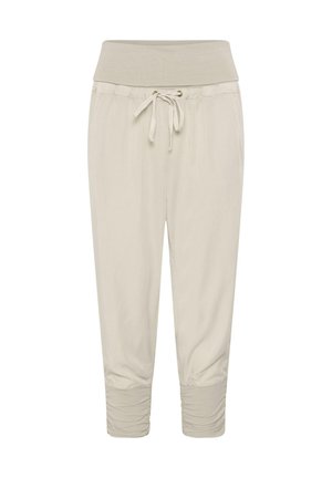 Pantalon décontracté beige clair avec taille haute élastique, cordon de serrage et poignets froncés aux chevilles pour une coupe décontractée.