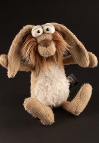 Brown plush rabbit toy with long floppy ears, a fuzzy white belly, and textured body. Features big eyes and a stitched brown nose.