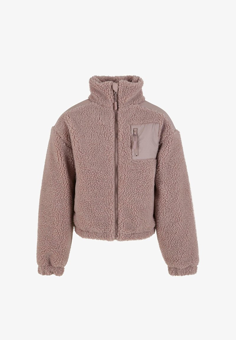 Aksomo striukė švelnios taupe spalvos, su aukštu apykakle, užtrauktuku ir kairiu krūtine kišeniu. Yra elastinės rankogaliai ir struktūrizuotas siluetas.