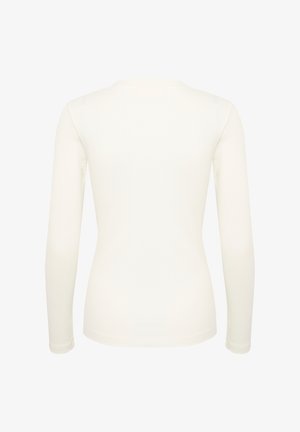 Langærmet, tætsiddende top i blød hvid ribbet stof. Har en rund halsudskæring og sømløse manchetter, som viser et glat, minimalistisk design.