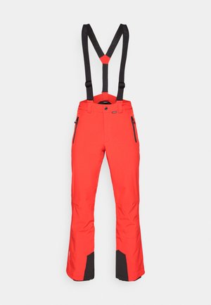 Pantalones de esquí impermeables rojos con detalles en negro, tirantes ajustables y bolsillos con cremallera. Textura suave, piernas anchas para mayor facilidad de movimiento.