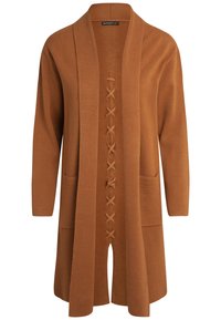 Kardigan w kolorze rdzy z kołnierzem szalowym, długimi rękawami, przednimi kieszeniami i sznurowanym detalem na środku. Miękka tekstura, długość do połowy uda.