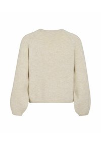 Maglione beige lavorato a maglia con scollatura rotonda, maniche raglan e finitura testurizzata. Taglio corto e comodo con orlo a costine.