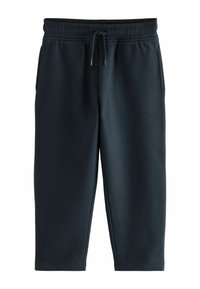 Mørkegrå sweatpants lavet af blødt materiale, med elastisk talje, snor og tapered ben uden synlige lommer.
