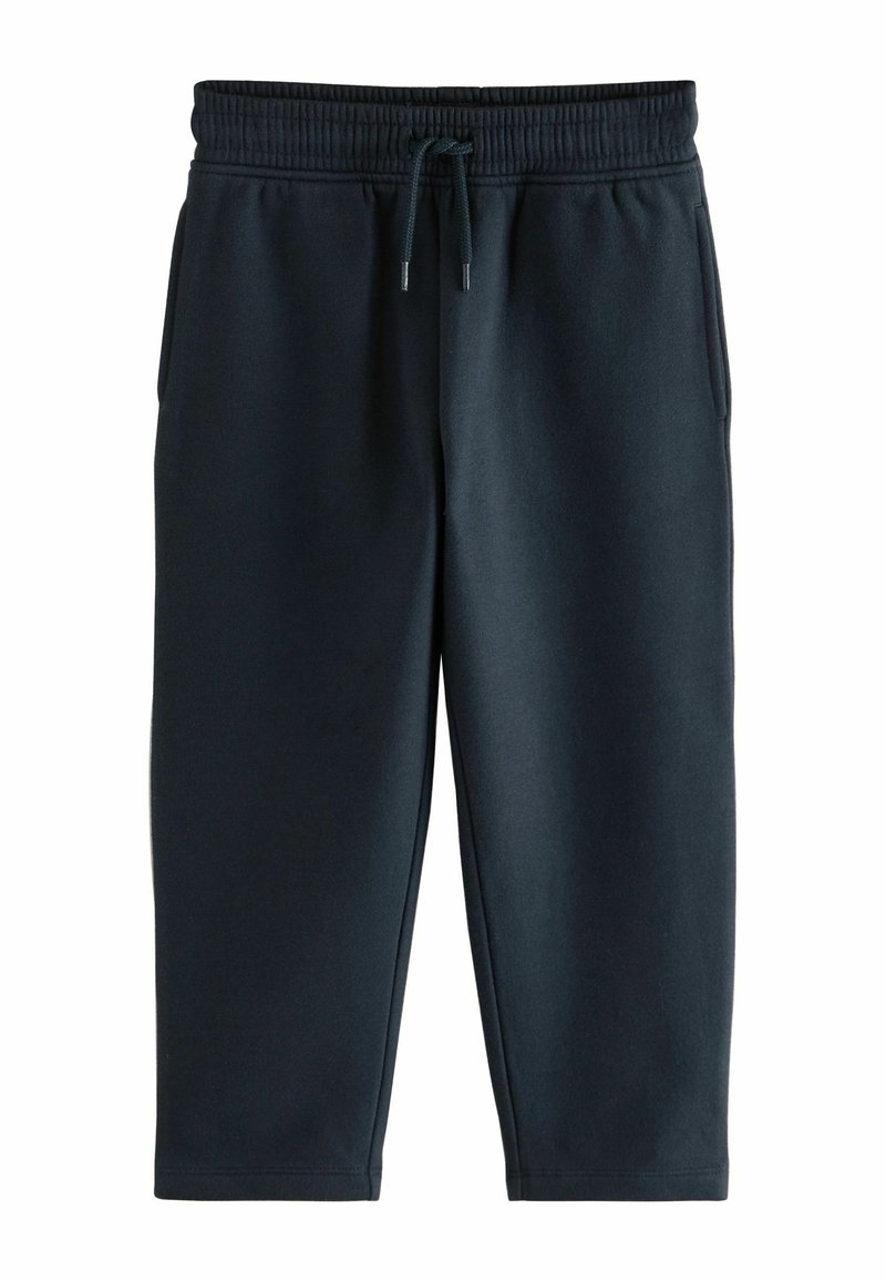 Mørkegrå sweatpants lavet af blødt materiale, med elastisk talje, snor og tapered ben uden synlige lommer.