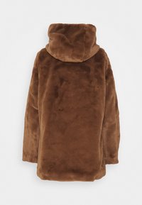 Brown faux fur coat with a high collar, oversized design, and soft texture. Features a relaxed fit and no visible closures.