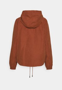 Rust-colored hooded jacket with elastic cuffs, drawstring hem, and a smooth texture. Features a simple, unembellished design.