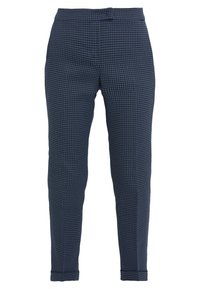 Patroonbroek in donkerblauw met een subtiel geometrisch ontwerp. Gemaakt van geweven stof, met een aansluitende pasvorm en taps toelopende benen.