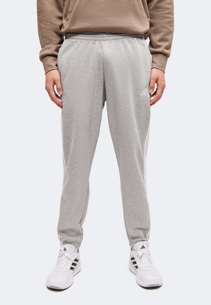adidas ESSENTIALS 3 STRIPES TAPERED CUFFED PANTS - Tracksuit bottoms - medium grey heather/white