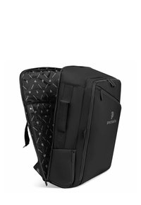 Sac à dos noir au design structuré, doté de zips extérieurs, de poches latérales et d'une doublure intérieure à motifs. Logo de la marque visible.