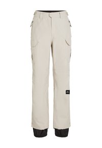 Beige snow pants with a relaxed fit, featuring cargo pockets, zippers, and black accents at the cuffs for added protection and style.