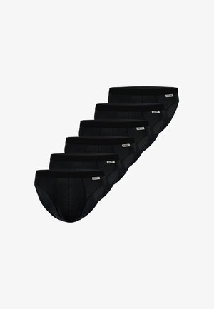 Six slips noirs pour hommes empilés en diagonale, chacun avec une petite étiquette blanche portant l'inscription « nur der » sur la ceinture.