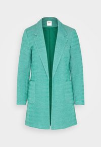 Türkiser Blazer mit Fischgrätenmuster, Reverskragen, zwei Fronttaschen und offener Vorderseite. Leicht strukturierten Stoff.