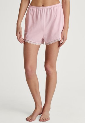 Roze katoenen shorts met een elastische tailleband en fijne kanten rand aan de zoom. Zachte stof met een relaxte pasvorm en een gladde textuur.