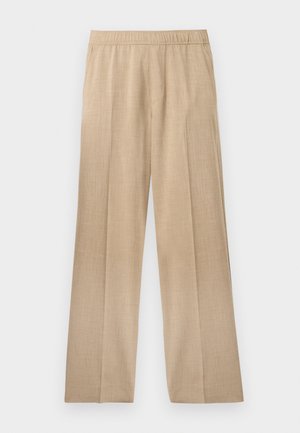 Bež hlače širokega kroja, narejene iz teksturiranega blaga, z elastičnim pasom in brez vidnih žepov ali okraskov.