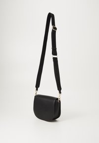 Tommy Hilfiger LOGOTAPE SADDLE BAG - Sac bandoulière - black