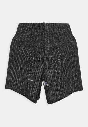Black and gray ribbed knit neck warmer with Calvin Klein label sewn on front, folded to display inside fabric texture.