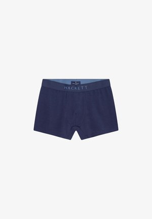 Marineblaue Boxershorts aus weichem Stoff, mit einem Bund, auf dem der Markenname "HACKETT" in hellblauen Buchstaben steht.