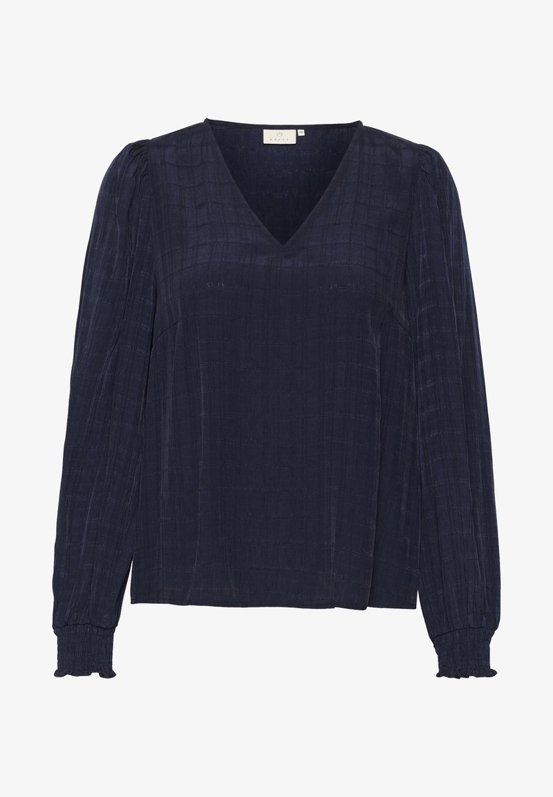 Blouse bleu marine à manches longues avec un motif à carreaux subtil, col en V, poignets froncés et épaules légèrement bouffantes.