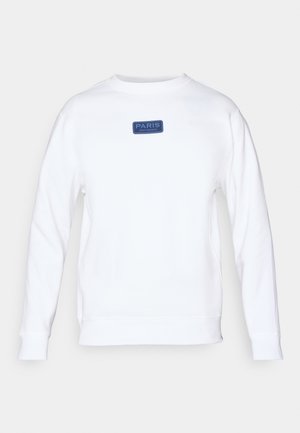 Hvid sweatshirt lavet af bomuld, med et rektangulært blåt mærke med teksten "PARIS" og "SAINT-GERMAIN" på forsiden. Casual pasform, rund hals.