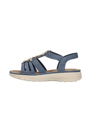 Sandale bleue avec des embellissements en gemmes, design à bout ouvert, sangles élastiques et semelle rembourrée beige. Présente une légère arche pour le soutien.