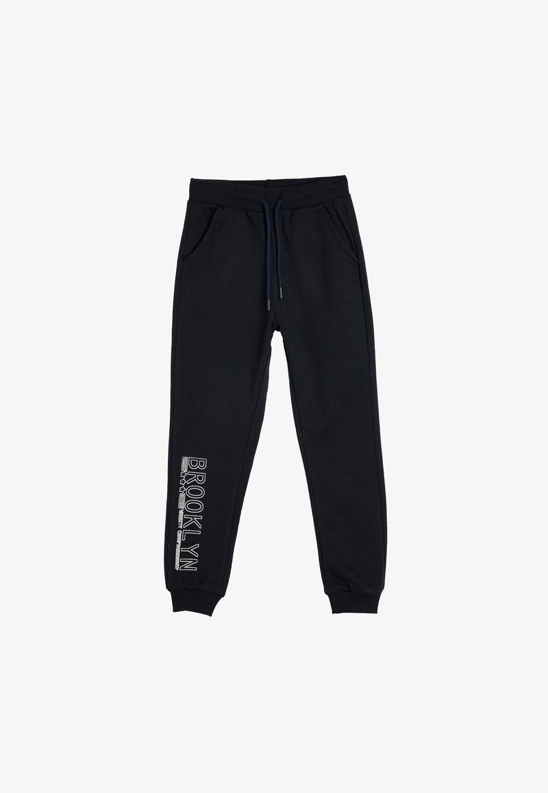Marineblauwe joggingbroek met elastische tailleband, trekkoord, zijzakken, opgeknoopte enkels en witte "Brooklyn" tekst op het linkerpant.