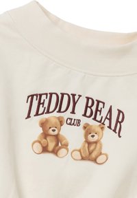 Felpa color crema con colletto a coste, decorata con una stampa che raffigura due orsetti e la scritta "Teddy Bear Club" in bordeaux.