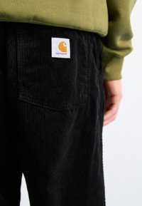 Carhartt WIP FLOYDE PANT - Pantalon classique - black rinsed