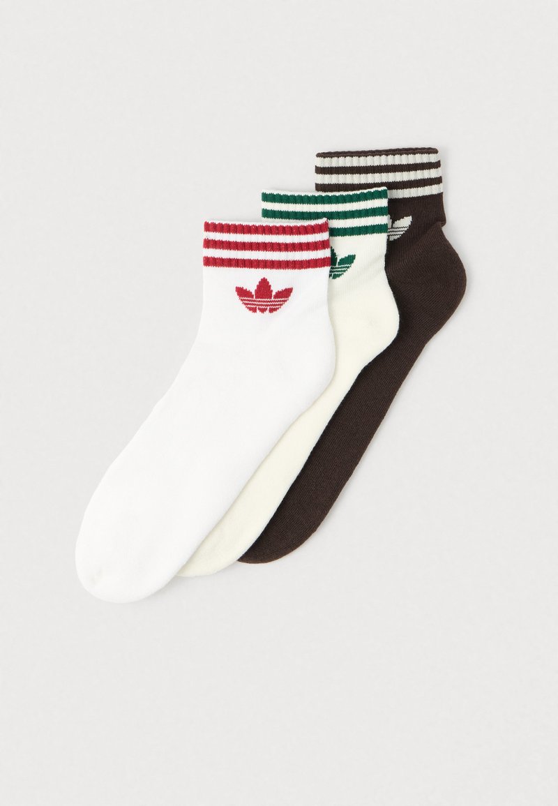 Cotton ankle socks set in white, cream, and brown, featuring colored striped cuffs and a logo on each sock.