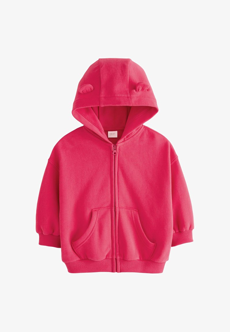 Sweat à capuche zippé pour enfant de couleur rose vif, avec poches avant, poignets et base côtelés, et une capuche avec deux petites oreilles en tissu.